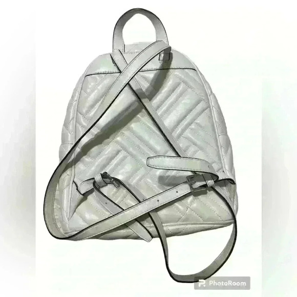 Michael Kors Abbey white quilted backpack. Silver hardware. Two zipper pockets. - Picture 2 of 12
